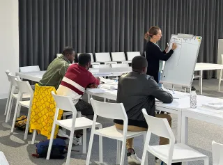 Un cours d'italien pour les travailleurs étrangers